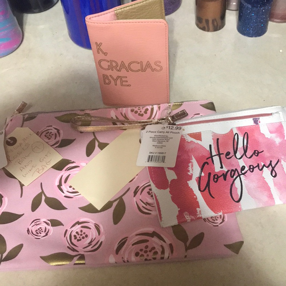 2 makeup bags and a passport holder
